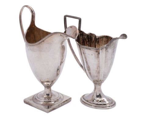 A George III pedestal cream jug, maker Peter &amp; Ann Bateman, London, 1793: of helmet type, raised on a square base, 16cm. 