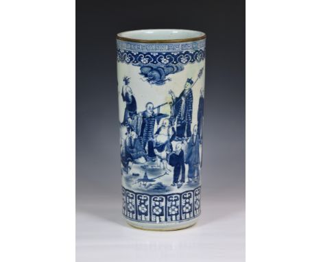 A Chinese porcelain blue and white stick stand, restored, probably 19th century, painted with immortals in a garden, a dragon