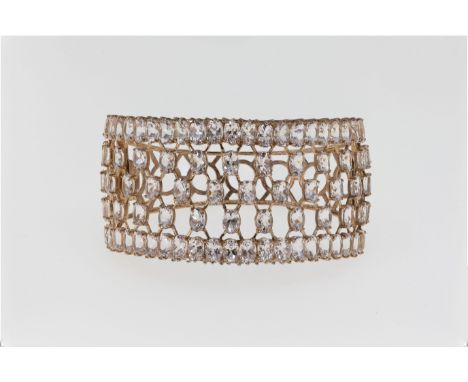 A 14ct rose gold and morganite cuff bracelet, featuring an open fretwork of rose gold wires holding oval cut morganite stones