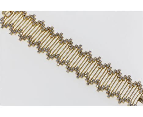A vintage silver gilt and cubic zirconia bracelet, 1960s-70s, the ladder form flexible bracelet with irregular border set wit