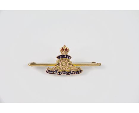 A 9ct two colour gold and enamel Royal Artillery sweetheart brooch, early 20th century, 42mm. long, yellow and rose gold, mar