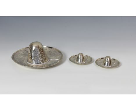 Three novelty Mexican silver Sombrero hats, each with silver hallmarks, stamped 'MEXICO' to the front and embossed and chased