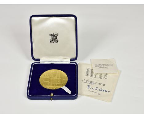 A Royal Mint 22ct gold medallion commemorating 900 years of Westminster Abbey, designed by Michael Rizzello, limited edition 