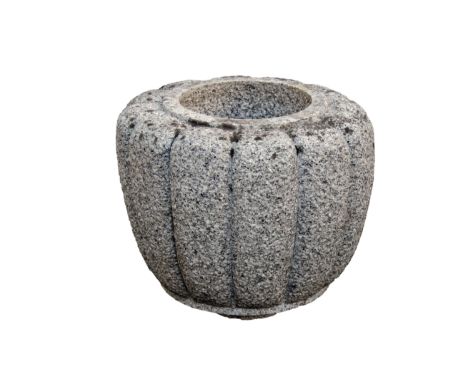 A grey granite garden planter / jardinière, of gadrooned bulbous form, 14in. (35.5cm.) high, 16in. (40.7cm.) diameter. 