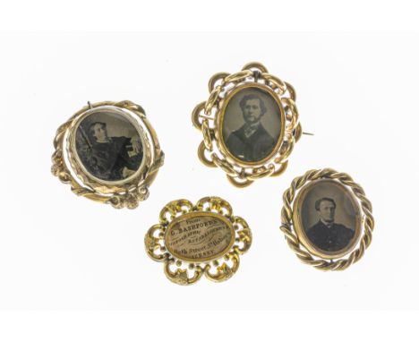 Three Victorian yellow metal swivel mourning brooches, two with double photographic portraits, the other with a photographic 