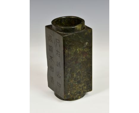 A Chinese carved jade cong, in dark spinach green and dark brown mottled jade, with dark tan and rust inclusions, the square 