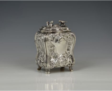 A George II silver bombe tea caddy, John Holland II, London, 1751, of bombe form, embossed in the rococo style with two panel