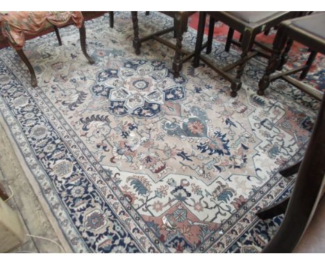 Light brown blue and beige patterned tasselled carpet (100" x 66"), single diamond to the central field