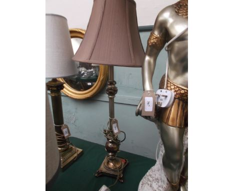 Metal based table lamp with pink parchment shade