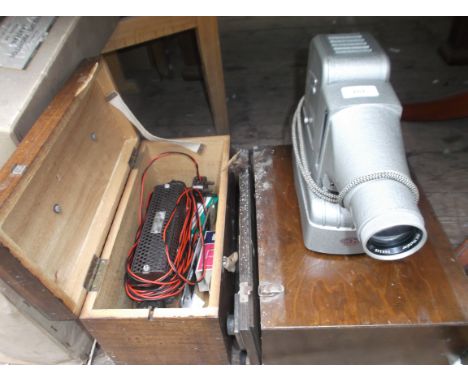 Knome projector in original case together with a boxed volt meter in original case