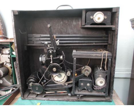 Very early baby projector with accessories in black wooden carrying case