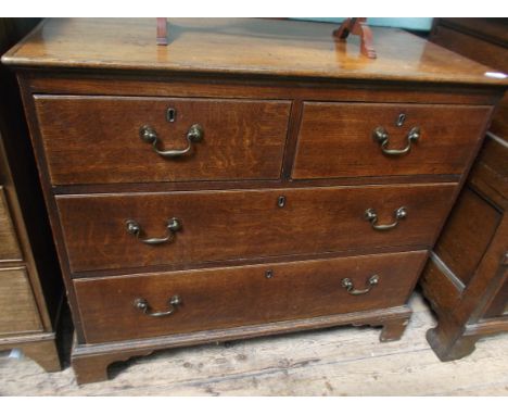 Oak period chest of 2 short and 2 long drawers all with brass drop handles on bracket feet (36" x 18 1/2" x 32" high)
