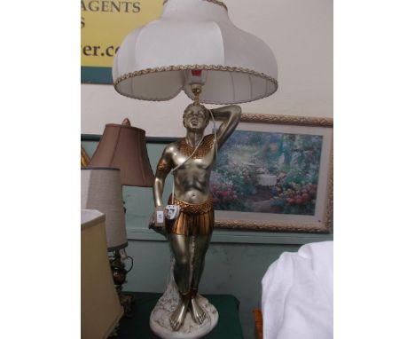 Ornate table lamp, the base in the form or a Roman Centurion (32" high) with white parchment shade