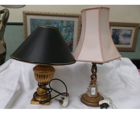 Oak twist stemmed table lamp with pink parchment shade and a modern gilt based table lamp with black paper shade