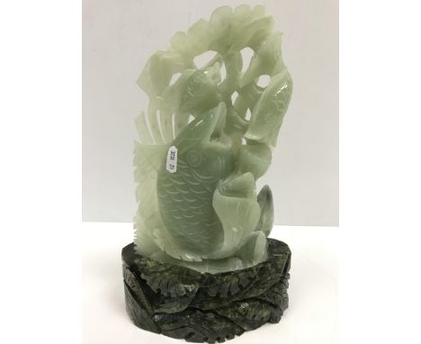 A 20th Century carved jade figure group of fish, approx 31.5 cm high