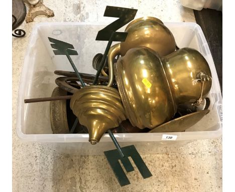Two large plastic crates containing various copper and brass ware including water pots, coffee pots, two spoked wheels, embos