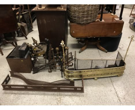 A collection of various fireside accoutrements including a brass fender with integral rests/tools circa 1830 107.5cm wide, a 