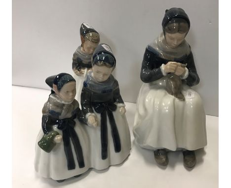 A collection of three Royal Copenhagen figures comprising a woman knitting No'd 1317 23 cm high, a girl wearing shawl No'd 12