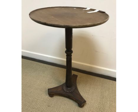 A 19th Century rosewood occasional table in the manner of Gillows, the replacement circular mahogany dished top and plain tur
