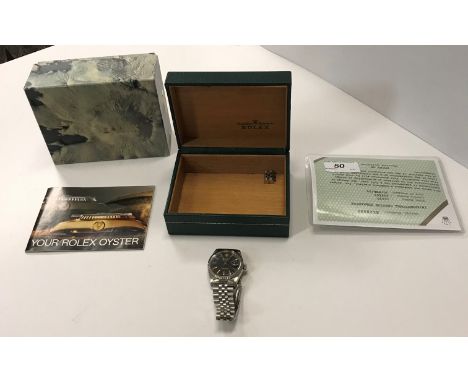 A gents stainless steel cased Rolex Oyster Perpetual Datejust chronometer, the black ribbed dial with gold battens and date a