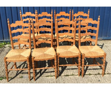 A set of eight modern pine rush seat ladder back dining chairs in the 19th Century manner, 42 cm wide x 43 cm deep x 105 cm h