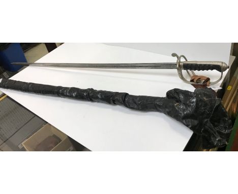An Elizabeth II Royal Artillery dress sword by Wilkinson Sword Ltd with engraved blade, open work knuckle guard and simulated