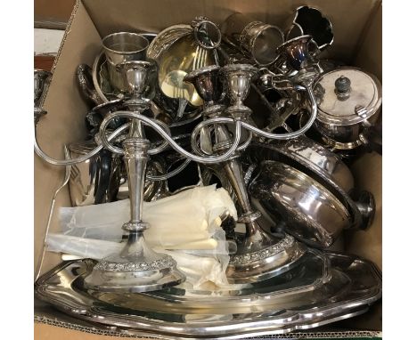 A box of assorted plated wares to include a pair of three branch candelabra, various serving trays, toast rack, tomato ketchu