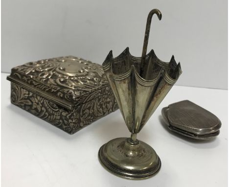 A collection of assorted silver and white metal wares to include an early 20th Century trophy top in the form of a gentleman 