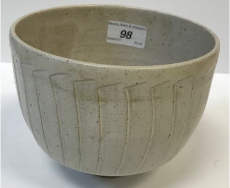 A David Leach cut sided vase in dolomite type glaze with unglazed circular foot, 12 cm high x 15 cm diameter, together with a