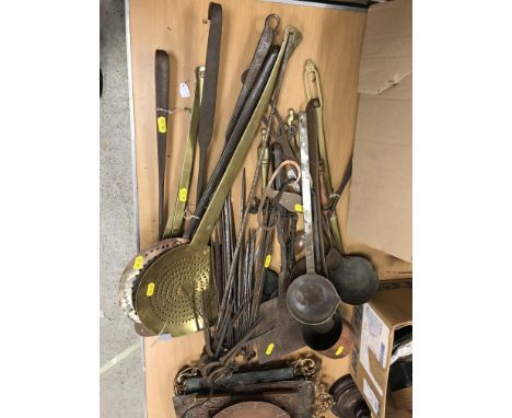 A collection of various kitchenalia to include 2 brass and 1 iron fish slices or spatulas, 2 18th Century iron handled brass 