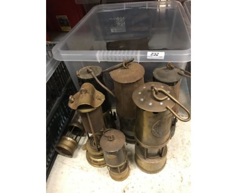 A collection of seven various miner's lamps including a Richard Johnson Clapham Morris of Manchester and Liverpool Lamp, a La