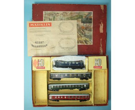 A Märklin HO gauge train set, comprising 3-rail DB blue twin pantograph electric locomotive no.E41024, two 4024 coaches, a 40