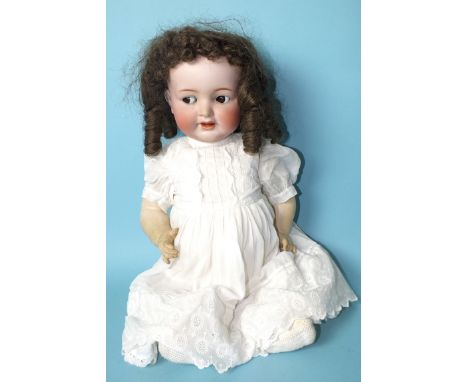 A Kammer &amp; Reinhardt Simon &amp; Halbig bisque baby head doll with brown flirty eyes, on jointed composition character bo