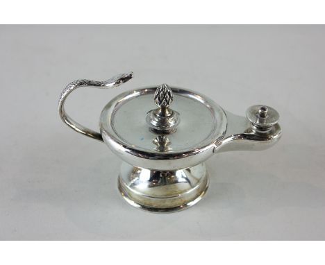 An 'Aladdin's Lamp' silver table cigar lighter with serpent handle on circular base (London early 1900s), 7cm high