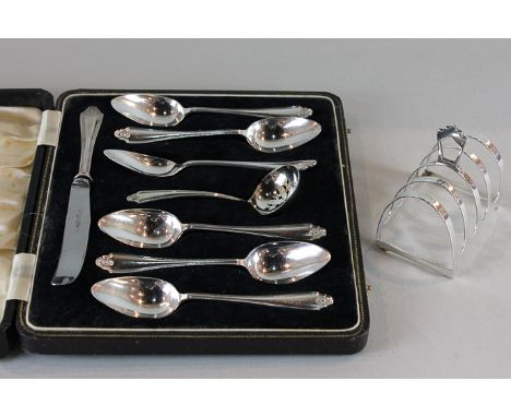 A set of six silver grapefruit spoons with sifter ladle and knife in case, together with a four-division silver toast rack, w