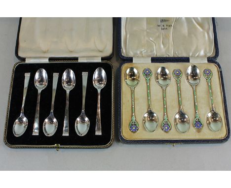 A set of six Walker and Hall silver coffee spoons with floral coloured enamel decorated handles, Birmingham 1935 in case, tog