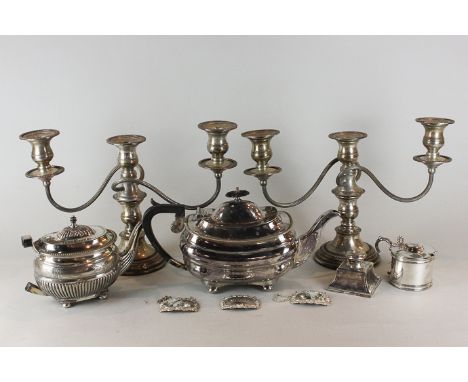 A pair of three light candlesticks with scroll branches, two teapots (a/f), an inkwell, mustard pot and three decanter labels