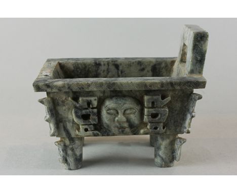 An oriental 'jade' trough with one end handle (the other missing) and mask and motif decorated sides on turned legs,  17.5cm 