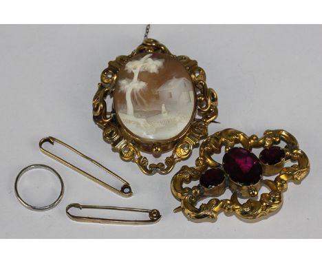 A 19th century shell cameo brooch, a 19th century gilt paste brooch, a platinum wedding ring, 2.9gms, and two 9ct  gold tie p