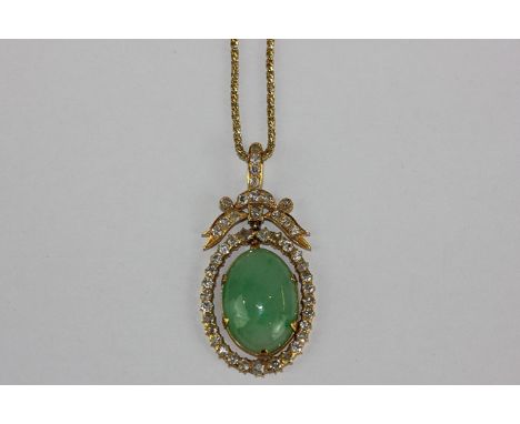 A jade and diamond pendant, the oval cabochon within a border and bow of mixed cut diamonds in 18ct gold 