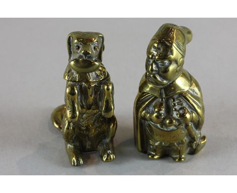 Two brass character pots with hinged lids in the form of a begging dog, and a bearded figure with cloak and cap, 7cm