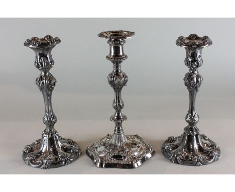 A pair of silver plated baluster shaped candlesticks with scroll decoration, 25cm, and another single candlestick with fan sh
