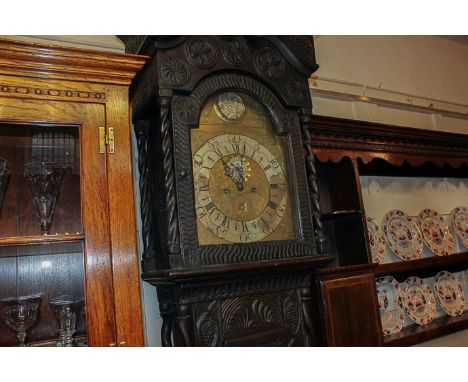 A Victorian longcase clock with engraved brass arch dial and silverized chapter ring with Arabic and Roman numerals and secon