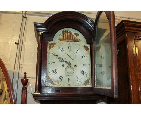 An early 19th century oak longcase clock, Wilmshurst Chichester, with arch painted dial and Roman and Arabic numerals and sec