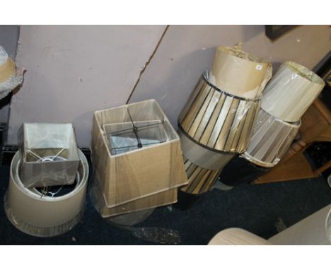 A LARGE QUANTITY OF ASSORTED LAMP  / LIGHT SHADES - ( AGAINST WALL)