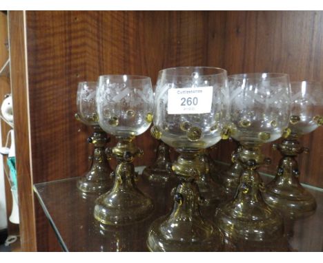 A SET OF NINE VINTAGE ETCHED GLASS GOBLETS 