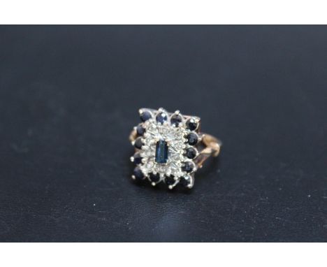 A SAPPHIRE AND DIAMOND DRESS RING, set on an unmarked yellow metal band, ring size K