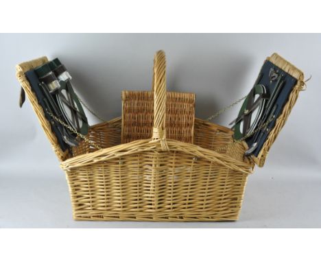 A wicker fitted picnic hamper and some cups, 24cm high x 52cm wide x 38cm deep