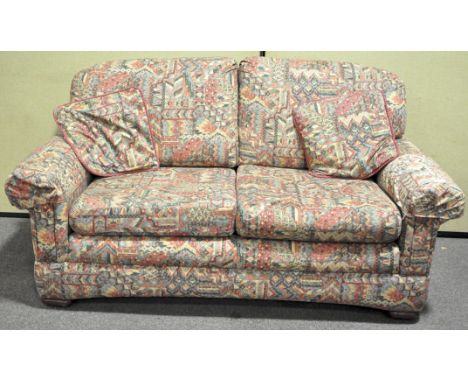 A Marks and Spencer abstract pattern upholstered  two seater sofa 175cm in length