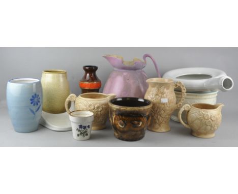A collection of assorted ceramic jugs and chamber pots to include Arthur Wood. Tallest measures; 29cm.